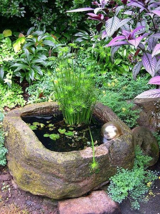 Stone Basin With Reflective Metal Sphere