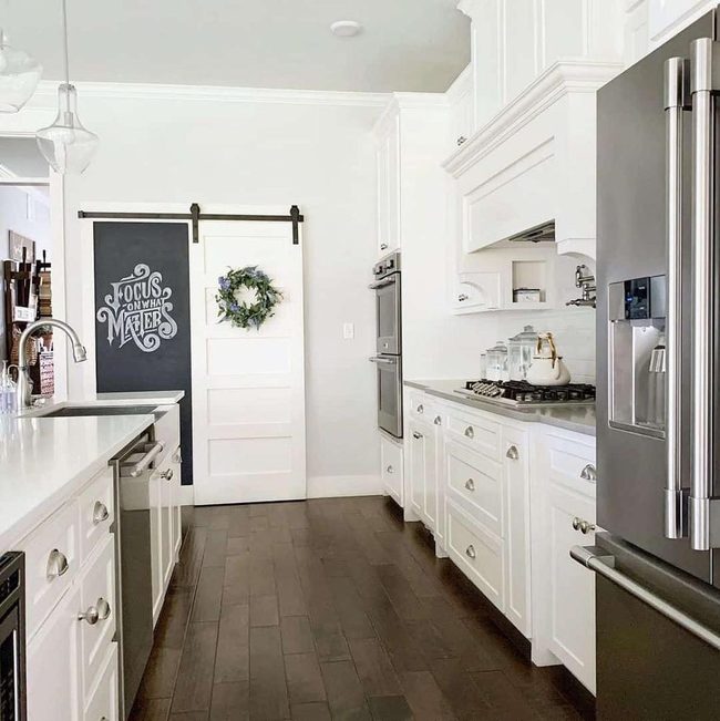White Barn Door With Green Wreath