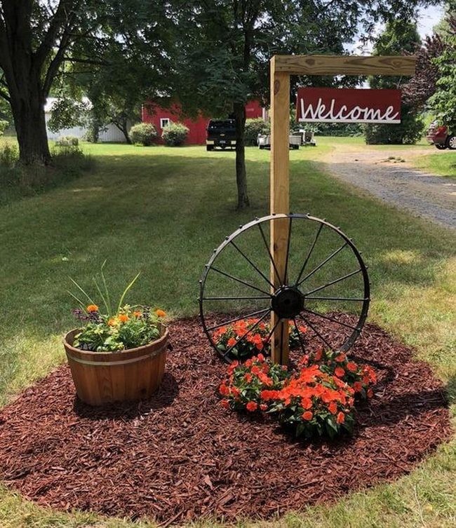 Weathered Wheel Among Blooms