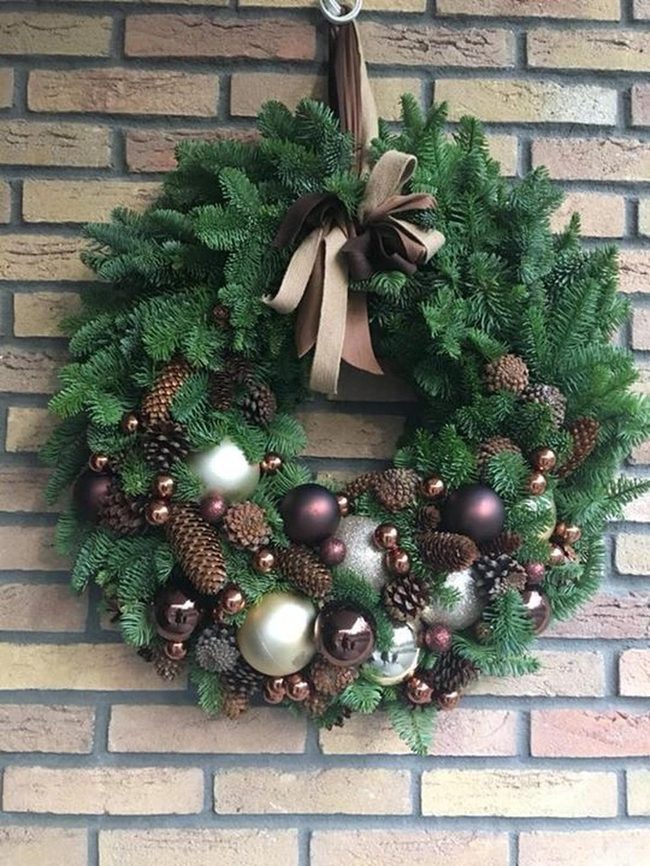 Golden Metallic Spheres On Green Pine