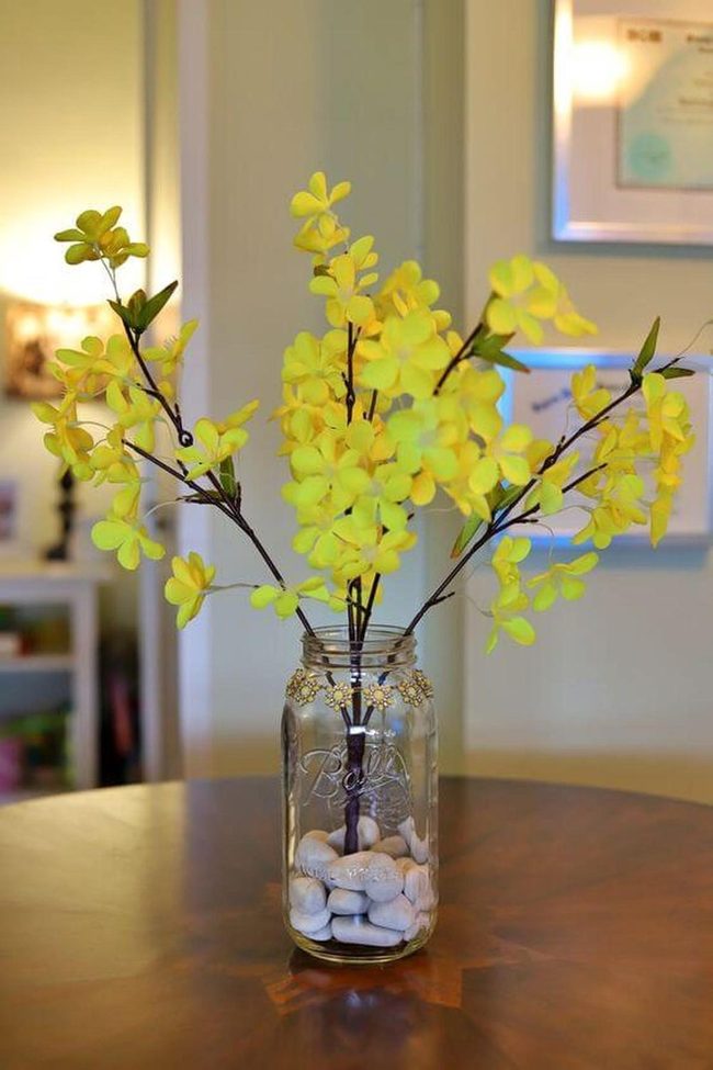 Yellow Blooms Over River Stone