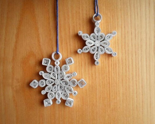 White Paper Snowflakes On Wood