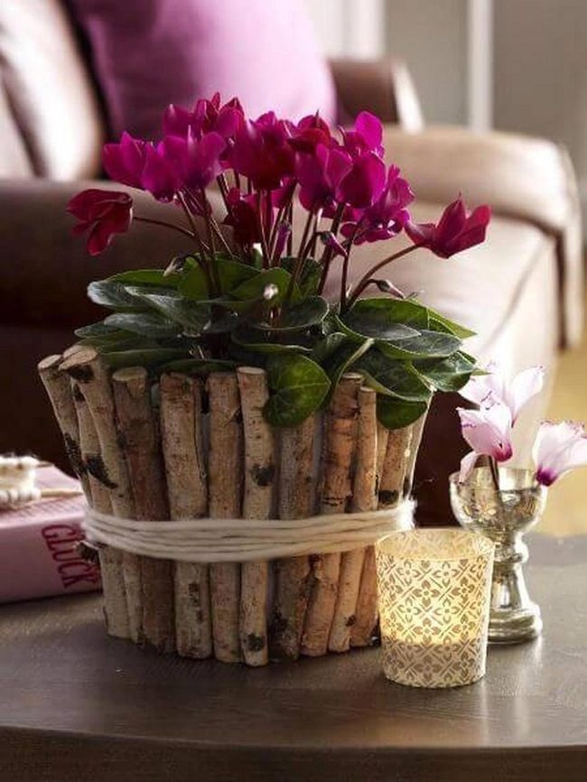 Purple Flowers In Twig Basket