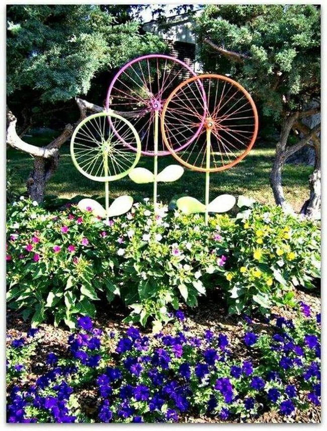 Painted Wheels Among Blooming Flowers