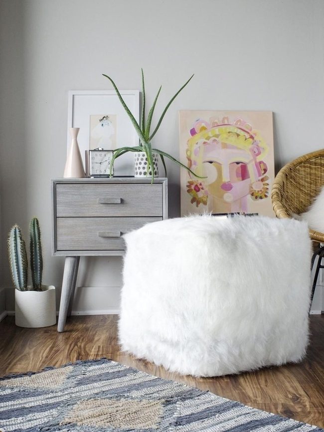 Colorful Face Art With Fluffy White Ottoman