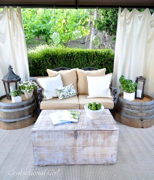 Candlelit Keg Lanterns And Sofa