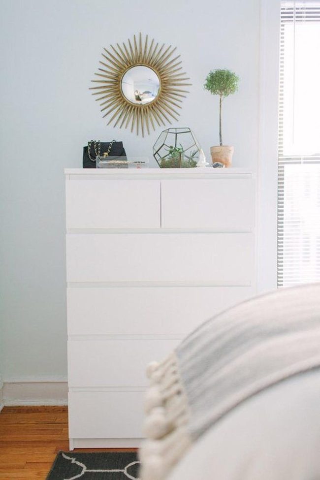Gold Mirror Brightens White Minimalist Bedroom