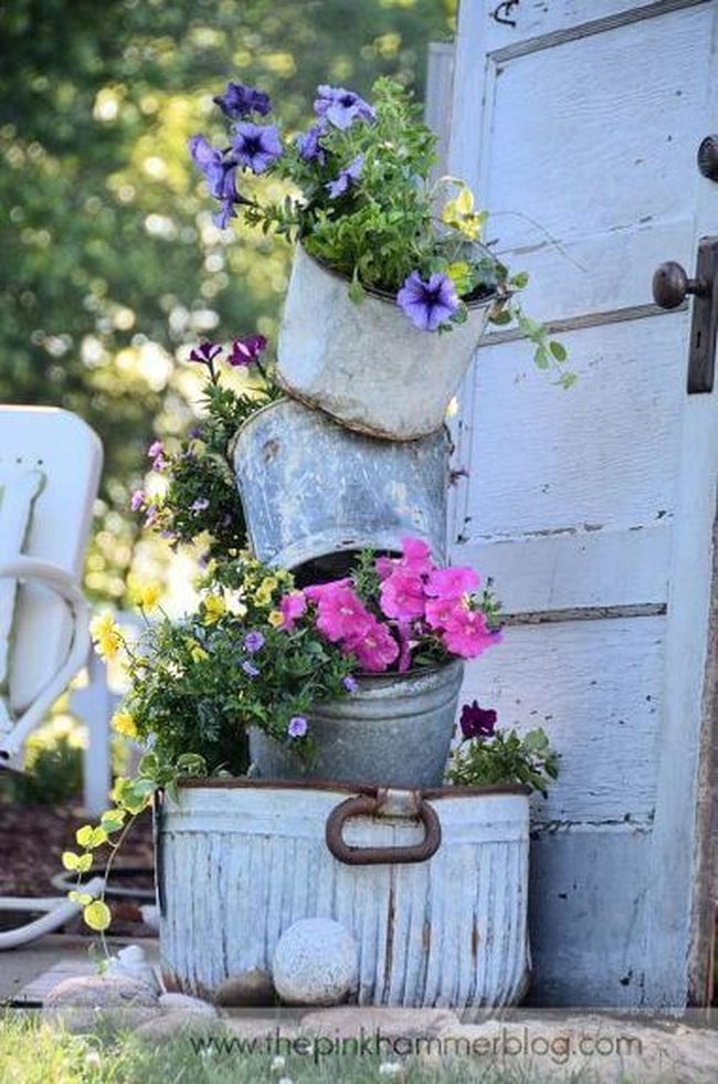 Stacked Metal Pots Bursting Blooms