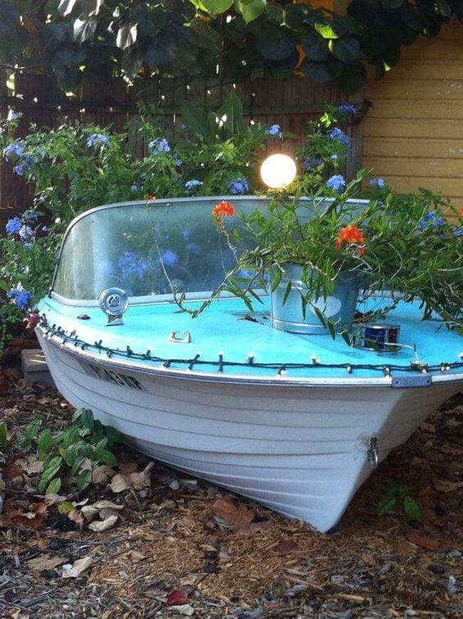 Weathered Boats Burst Blooming Flowers