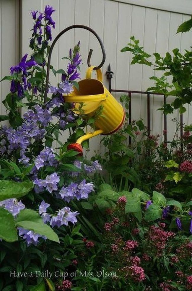 Yellow Watering Can Garden Oasis