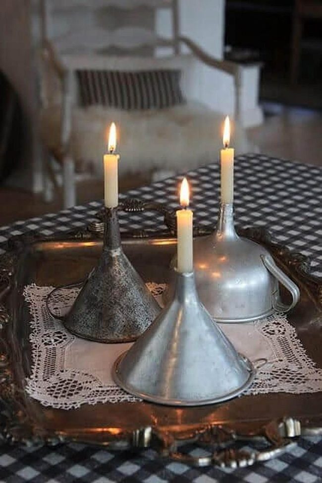 Metallic Funnels Glowing Candlelight