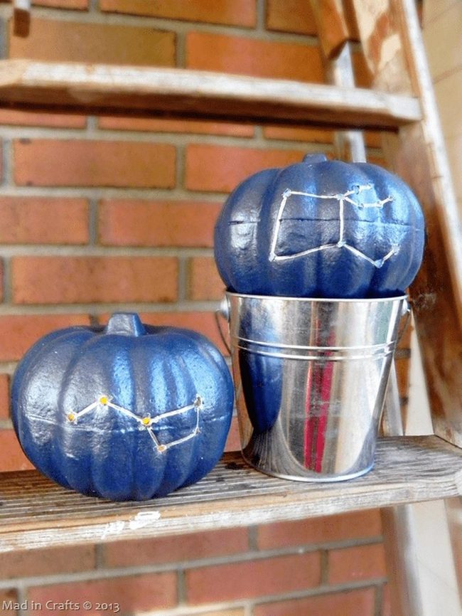 Blue Pumpkins Against Brick Wall