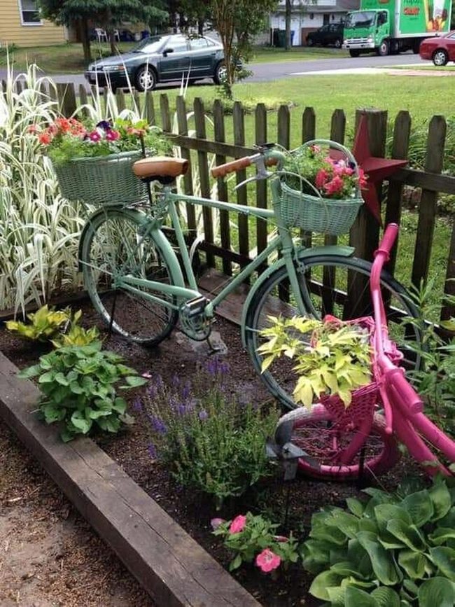 Bicycle Planter Overflowing Bright Blooms