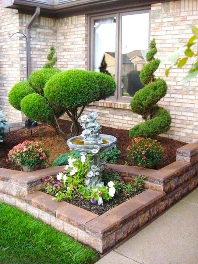 Sculpted Topiaries Around Flowing Fountains