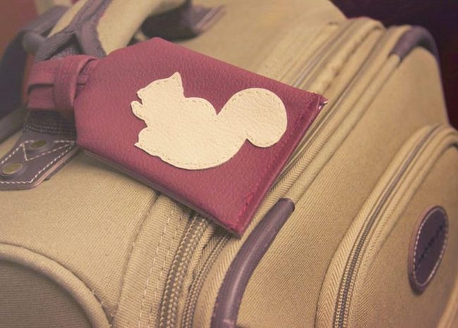 Tan Leather Suitcase With Purple Pockets