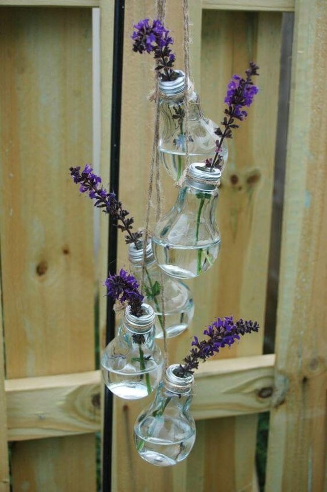 Suspended Glass Bottles With Flowers