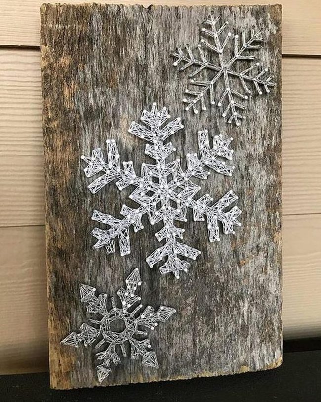 White String Snowflakes On Weathered Wood
