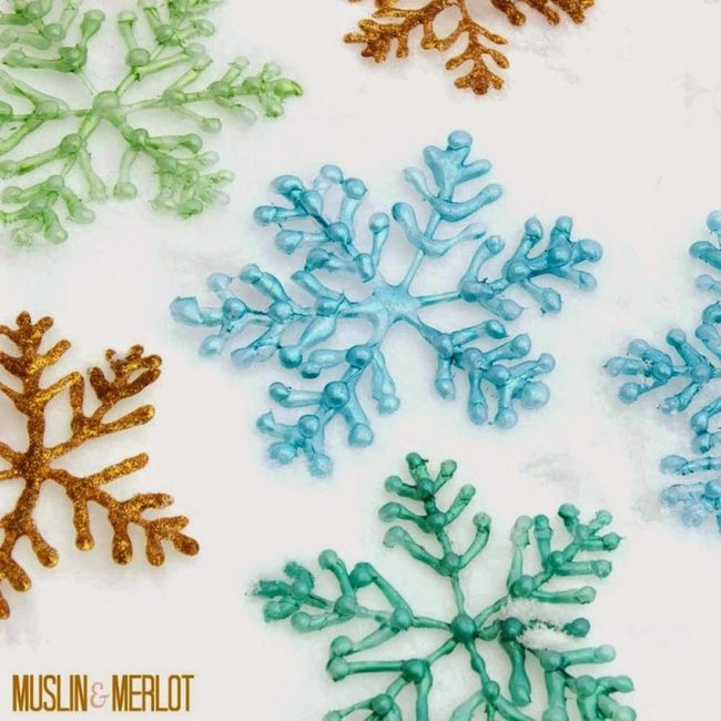 Shimmering Green And Gold Paper Snowflakes