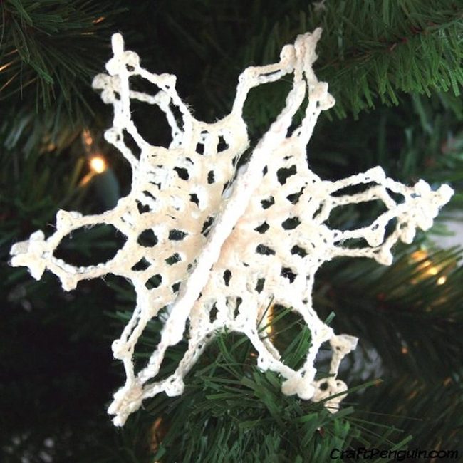 White Yarn Snowflakes On Evergreen
