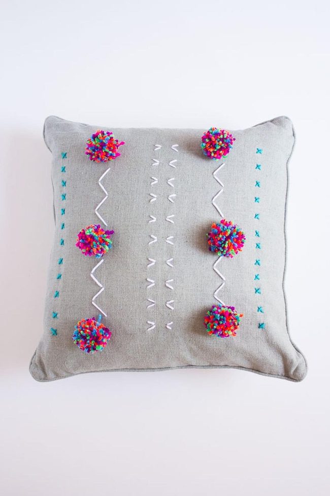 Gray Pillow With Pom-Pom Details