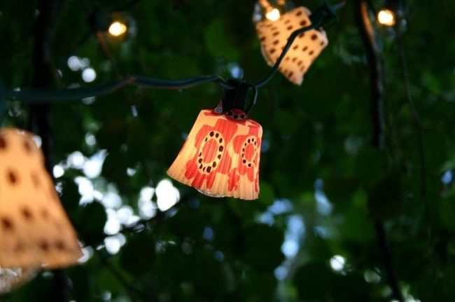 Orange Lanterns Floating Through Trees