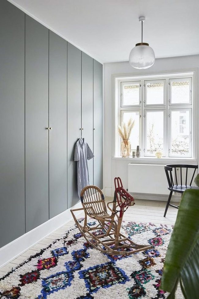Gray Walls With Colorful Patterned Rugs