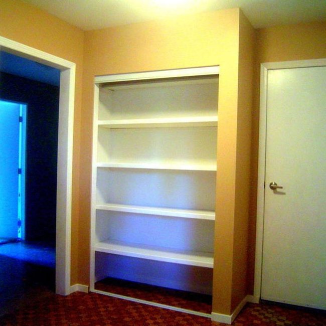 White Shelves Tan Walls Brown Floor