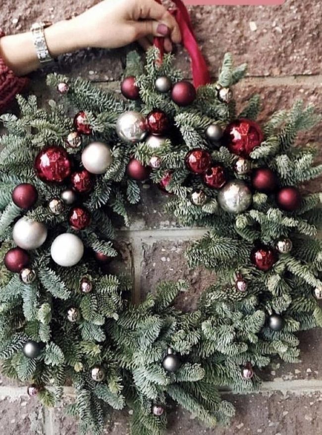 Shiny Red Baubles On Green Pine