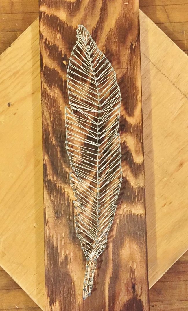 White String Feather Dark Wood