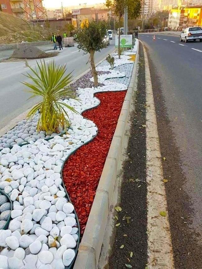 Painted Stones Frame Garden Beds