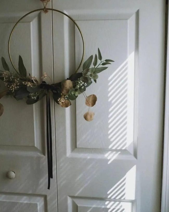 Gold Wreath Against Gray Door