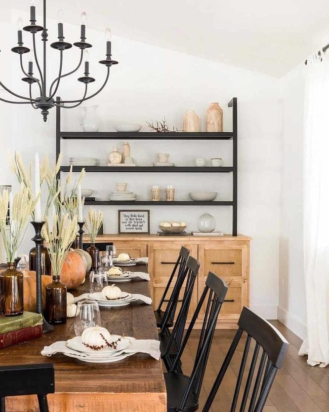 Black Shelving With Gold And White Dishes
